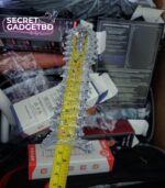 Clear extra dotted ribbed reusable silicone sleeve measured with tape